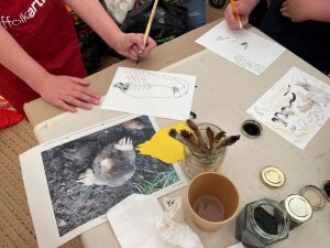 Participants creating art from natural inks.