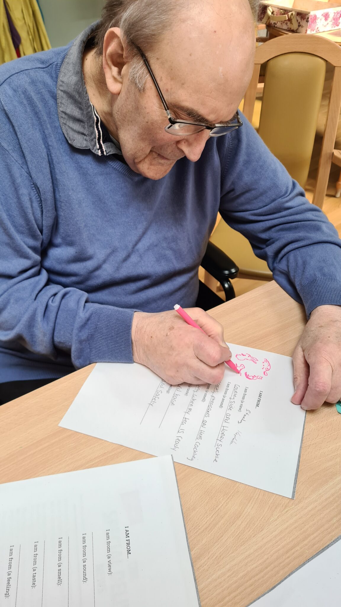 A gentleman decorating a hand written poem