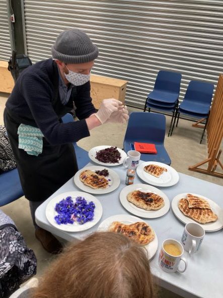 A chef prepares a table of different food