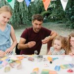 Family making plasticine creations