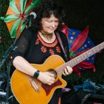 Guitarist performing on stage at Garden Party