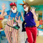 2 waving clown doctors