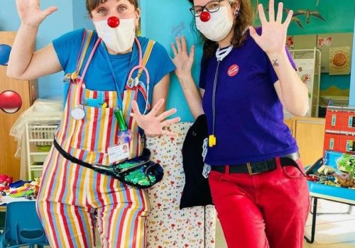 2 waving clown doctors