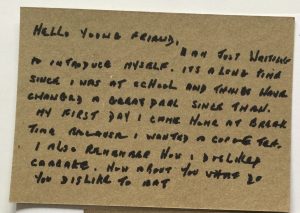 A handwritten postcard addressed 'Hello Young Friend