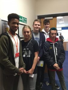 A group of five young people, posing for a photograph in Lowestoft Library