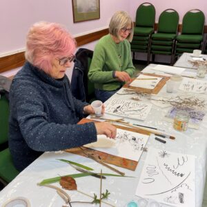 Two of our Friend's Around the Table participants from Woodbridge, making prints using natural materials.