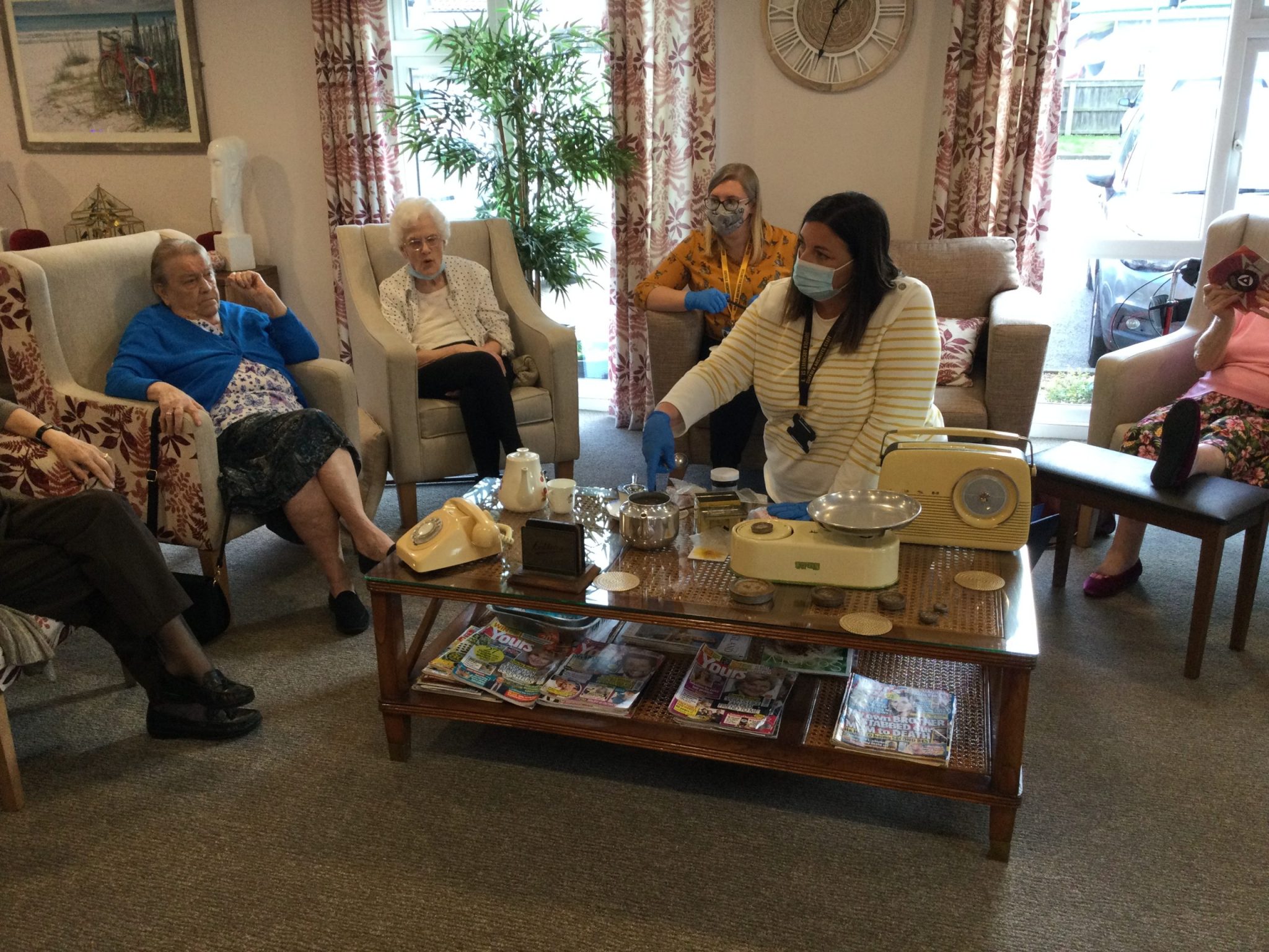 Residents at Hildesley Court enjoying a session with objects from the Suffolk Record Office