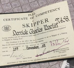 A photo of a Certificate of Competency as a skipper, awarded to Derrick Charles Martin in 1955