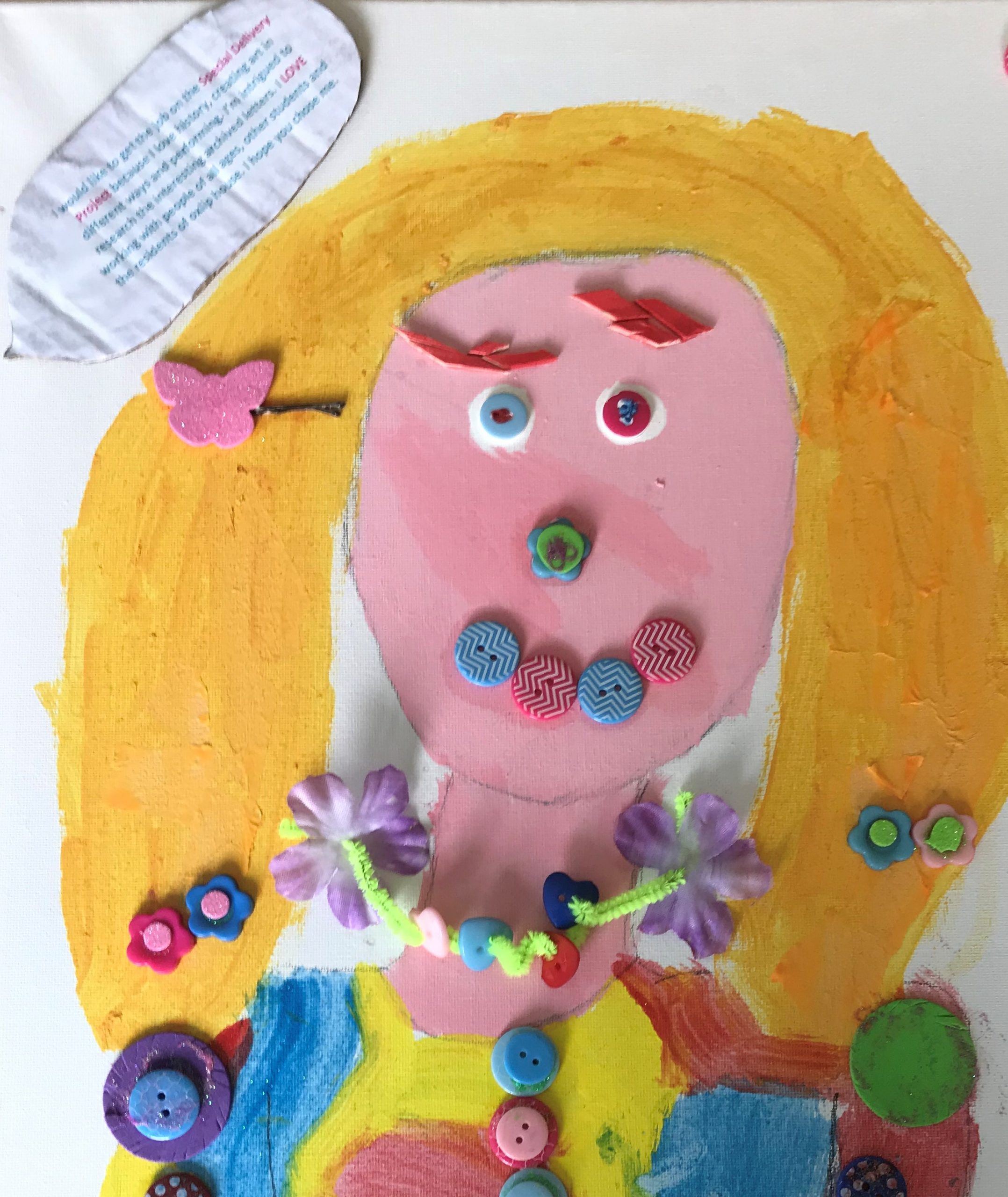 A brightly painted picture of a child's face, decorated with buttons