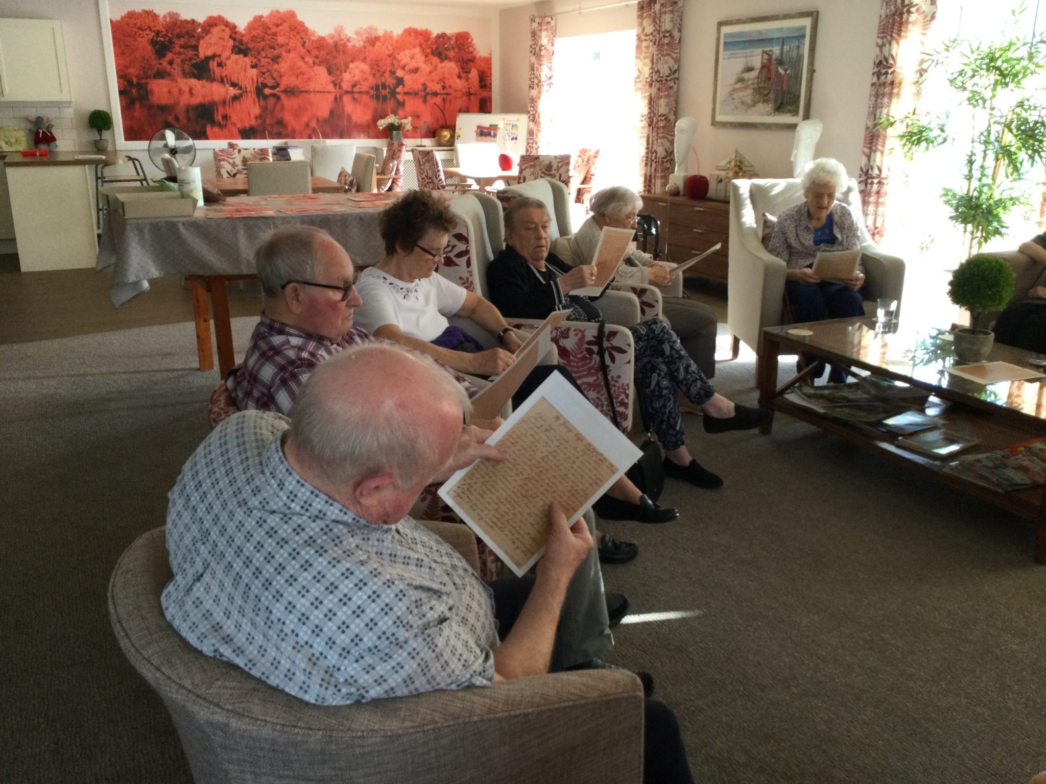 A group of residents studying the handwritten letter