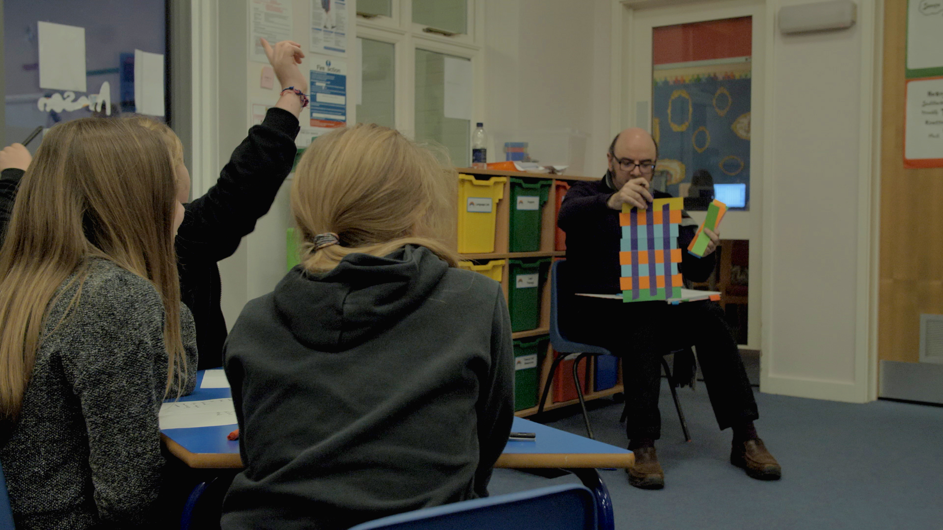 Children taking part in a poetry session with poet Dean Parkin