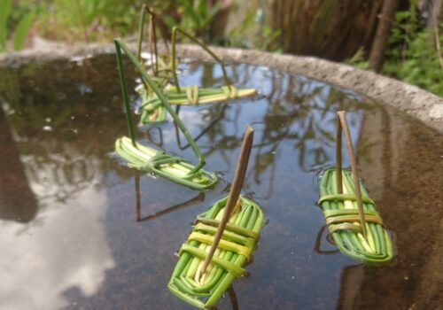 6 Reed boats in a shallow basin