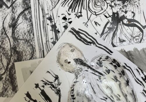 Stack of black and white abstract drawings