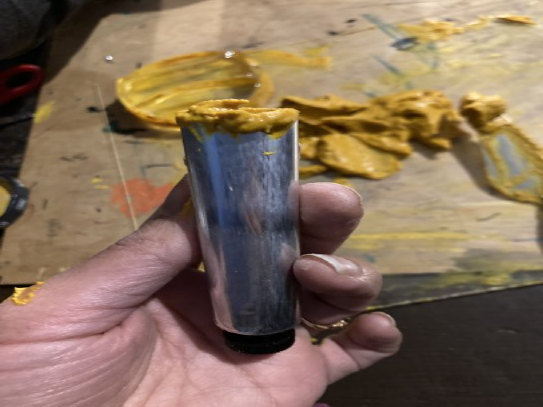 Filled paint tube