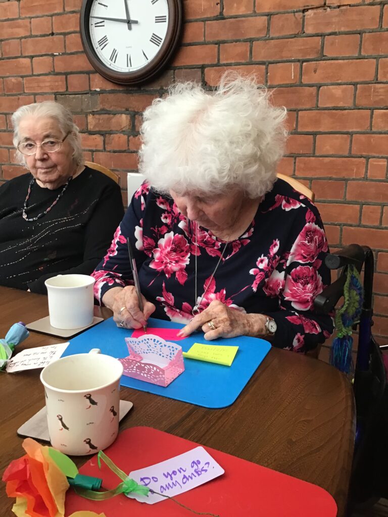 Resident writing a question for the Archive trip