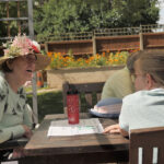 Meeting for tea in the garden at Beech House