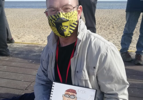 Student Erik shows his picture 'Our Amazing Self' whilst at Lowestoft beach