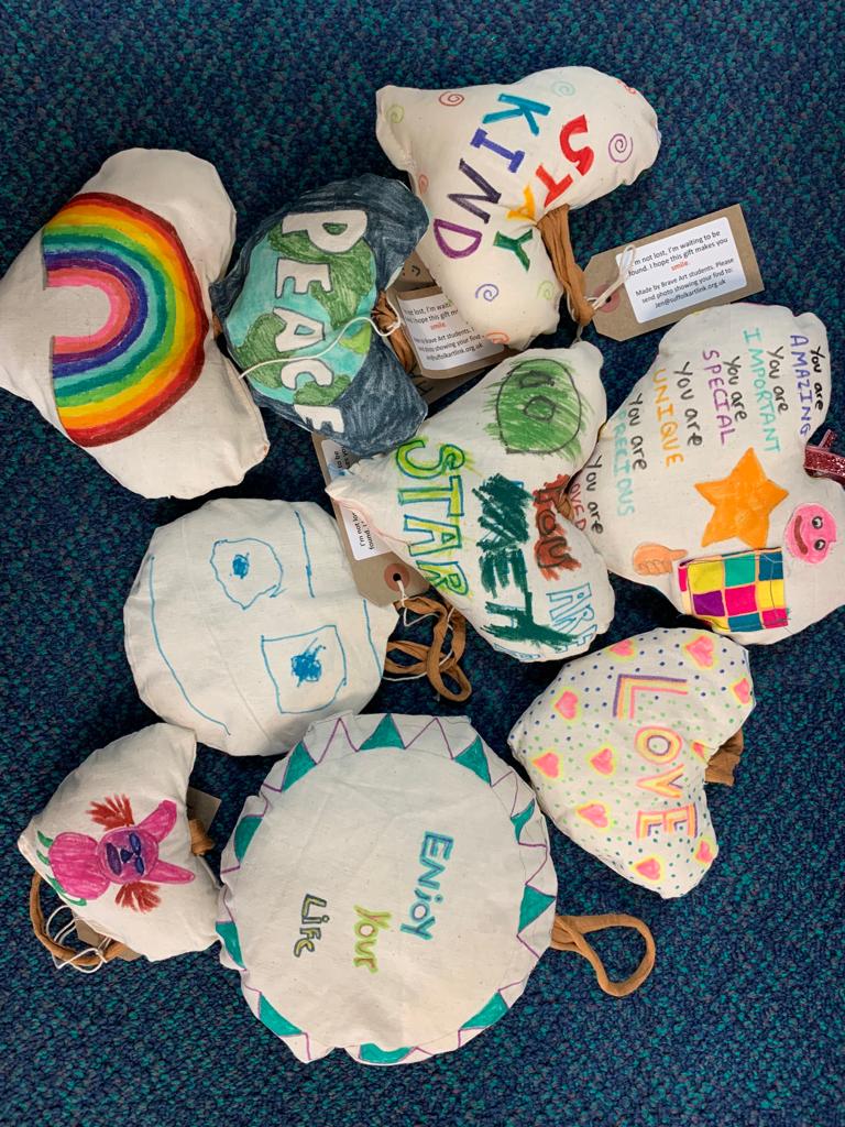 Collection of cloth hearts and circles with messages of joy