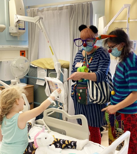 Clown Doctors visiting a child in hospital