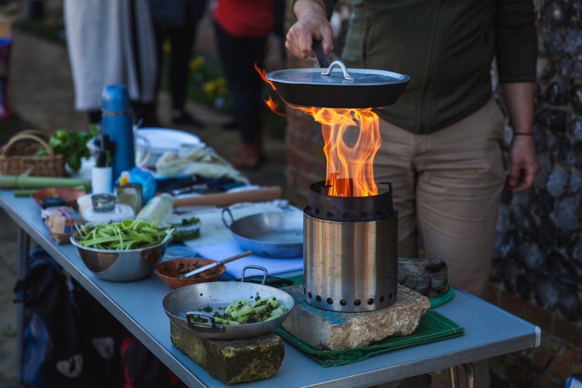 Cooking outdoors on a wood gas stove