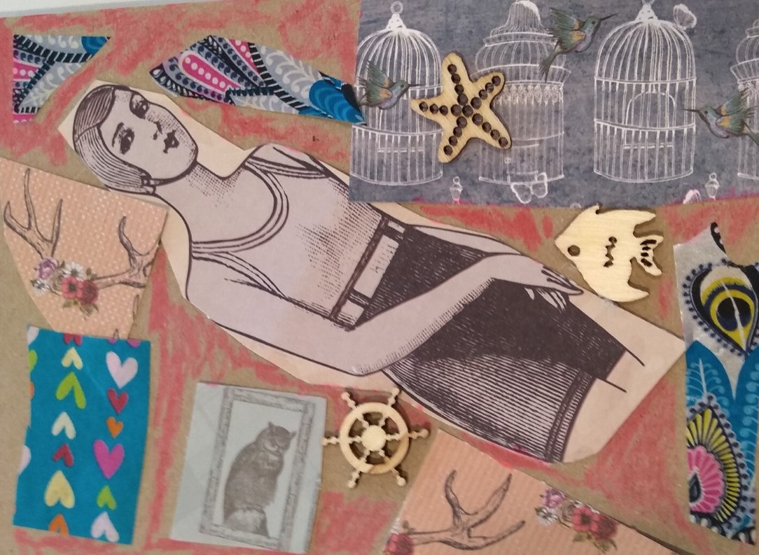 A collaged postcard, embellished with a variety of images and materials including a snippet from a vintage advertising image of a woman in a bathing suit, wooden cut out shapes of a star fish, an angel fish and a ship's wheel, paper printed with 3 white bird cages and hummingbirds, plus other small random patterned pieces.