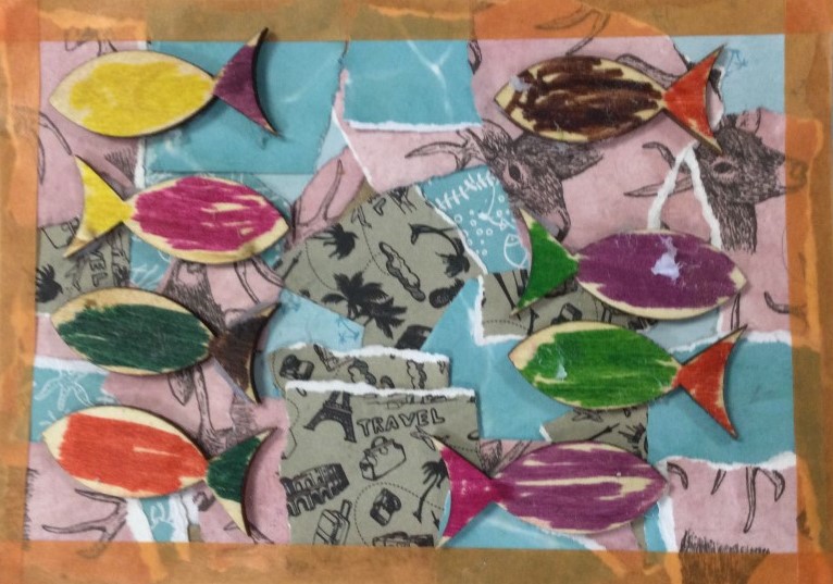 A collaged postcard with a background of tiny snippets of coloured and decorated paper, overlaid with 8 small wooden fish glued on top, each individually colour yellow, red, green or brown
