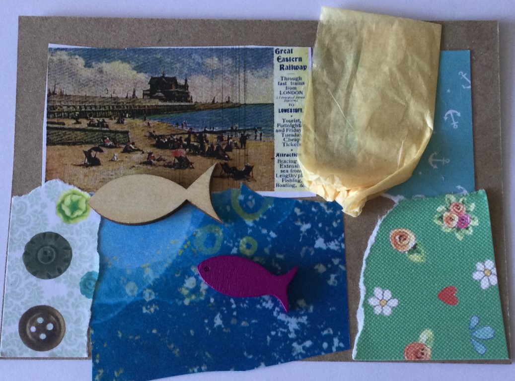 A brown postcard collaged with snippets of vintage postcards, coloured and patterned papers, yellow tissue paper and some small wooden fish