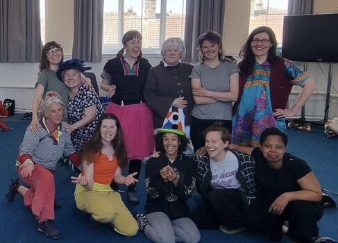 a group shot of workshop participants looking to the camera