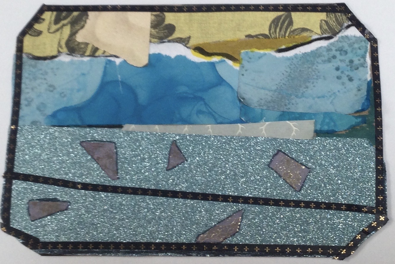 This collaged postcard is primarily blue in colour, with a sparkly blue paper along the bottom, overlaid with dark blue and gold tape and small silver shapes. The card is bordered in the same blue and gold tape and the corners have been cut off to create an 8-sided card