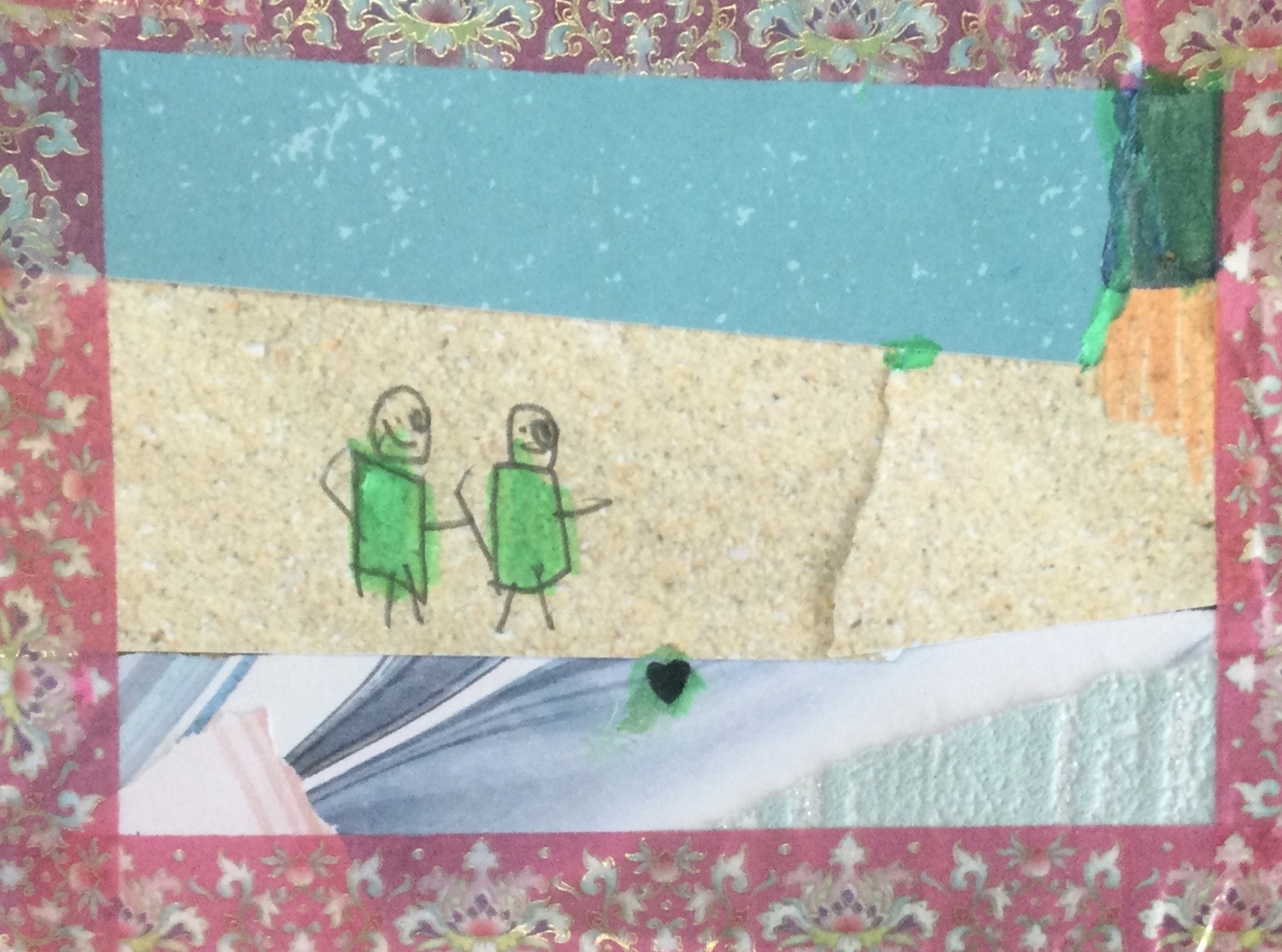 A collaged postcard featuring 3 horizontal strips surrounded by a pink patterned border on all edges. The top stripe of paper is blue, under which is a beige strip, with two hand drawn figures, coloured in green; the bottom strip is a collection of patterned papers in light blues and white, creating the effect of the sea