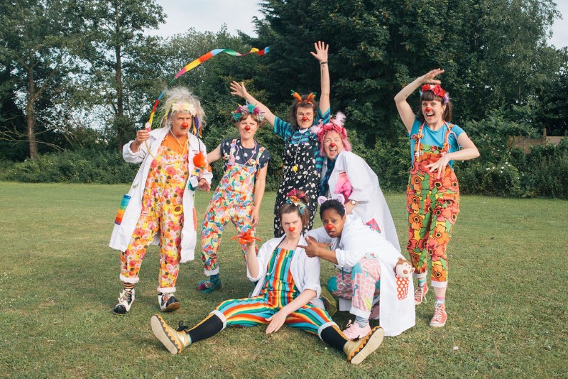 A group photo of seven clowns