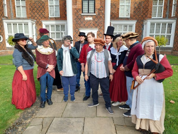 A group of participants and staff in Tudor costume