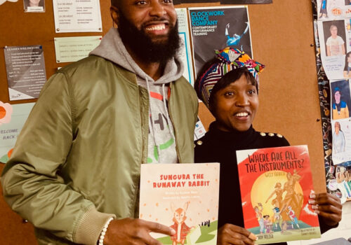 Authors Nate Holder and Kayleen Shani exchange their children's books Sungura the Runaway Rabbit and Where are all the instruments? West Africa.