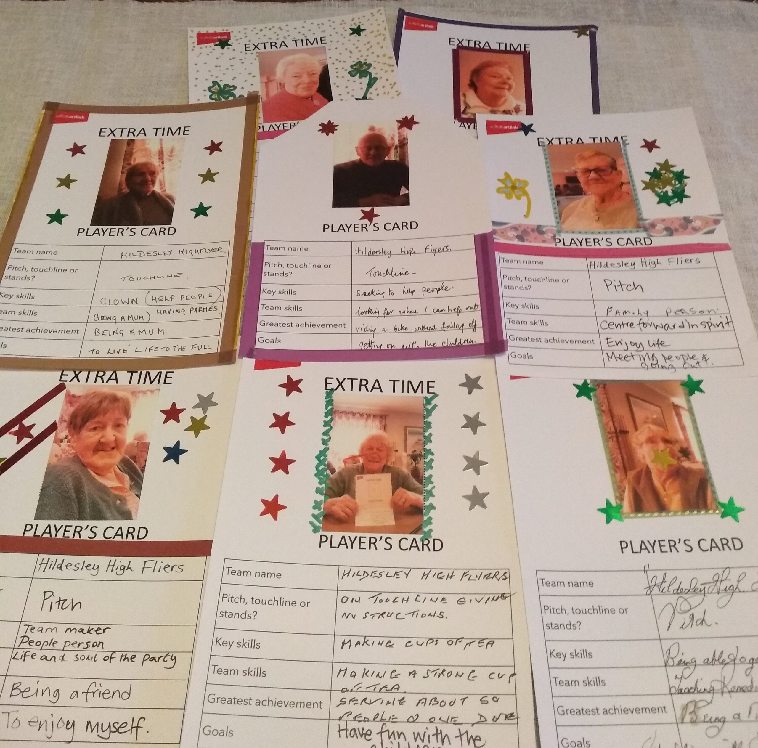 A collection of cards, each with a photograph of an adult and lists of skills, achievements and goals