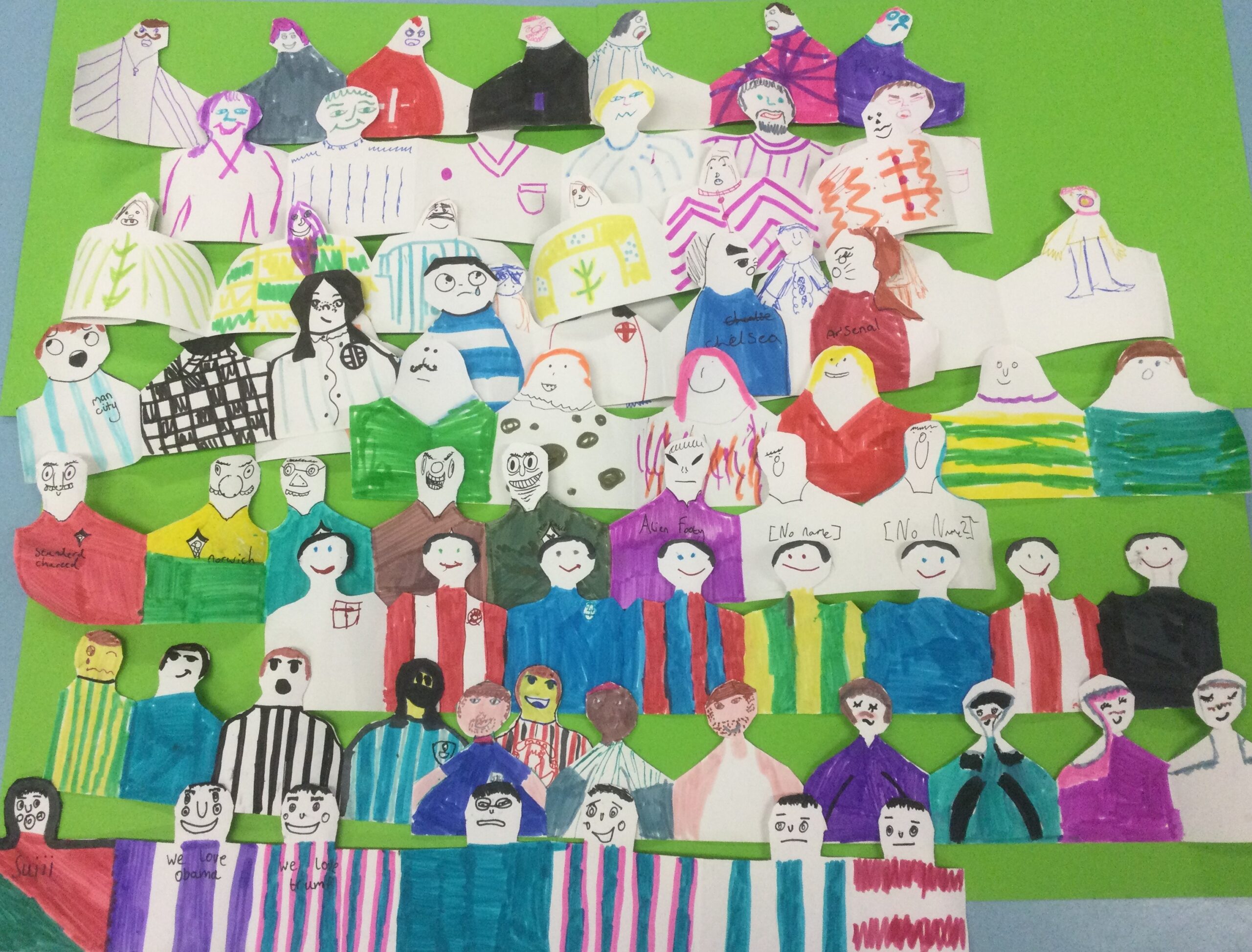 A colourful array of lines and lines of paper spectators drawn and decorated by hand