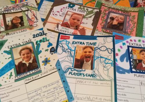 A collection of cards, each with a photo of an individual child, decorated and listing skills, achievements and goals