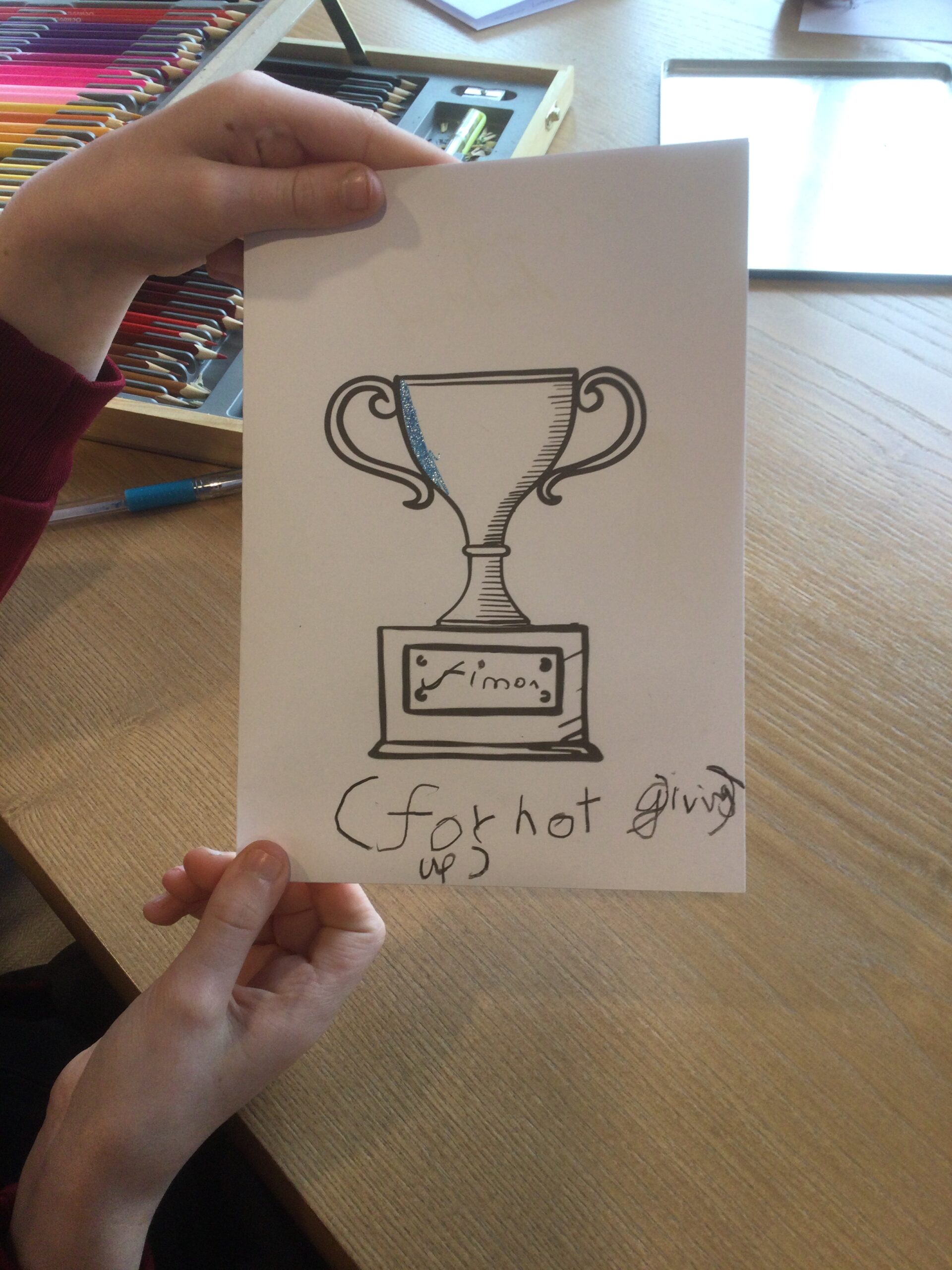 A trophy card with inscription For Not Giving Up