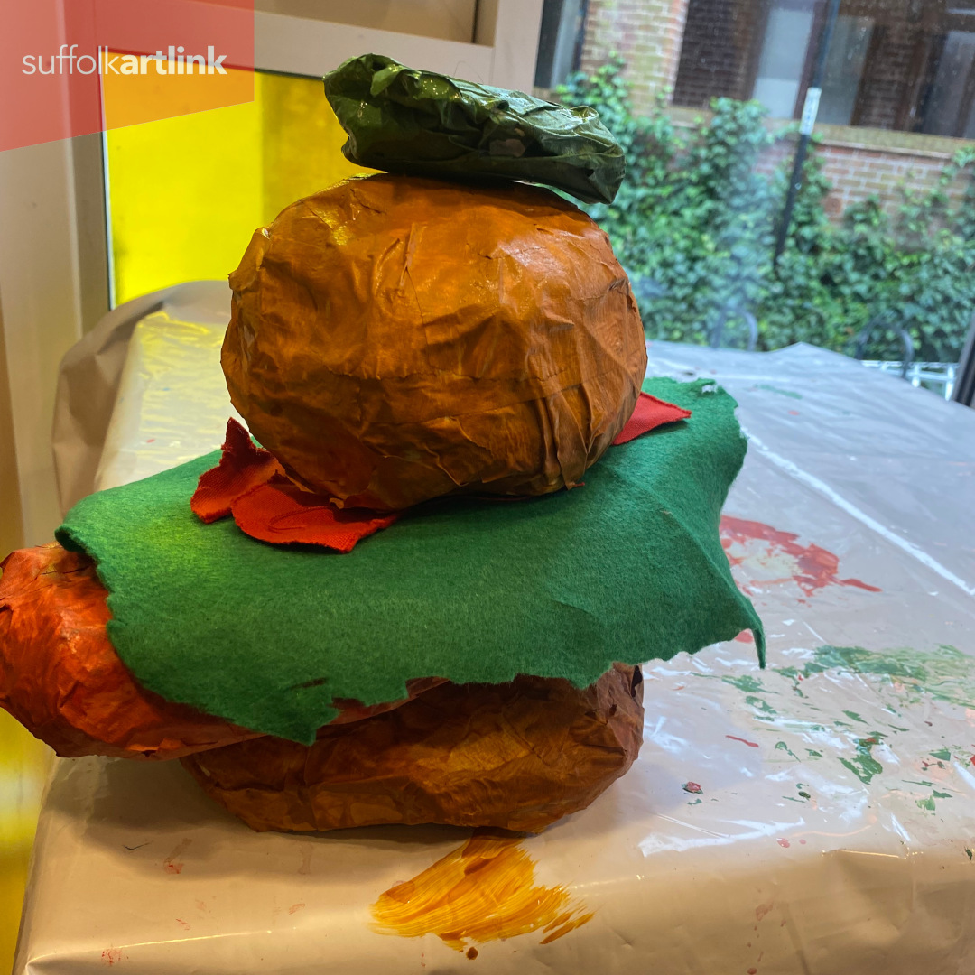 A pop art sculpture of a Sloppy Joes burger