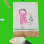 Drawing of female football figure wearing pink and white striped kit with number 12 on jersey, balancing football on foot
