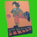 A hand coloured football figure with leg outstretched balancing a football. Green top, red shorts with IP7 on jersey