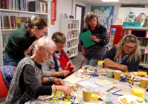 Suffolk Artlink workshop where participants are doing printing.