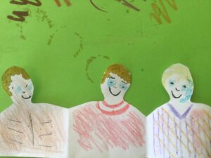 Three hand drawn figures on a green background