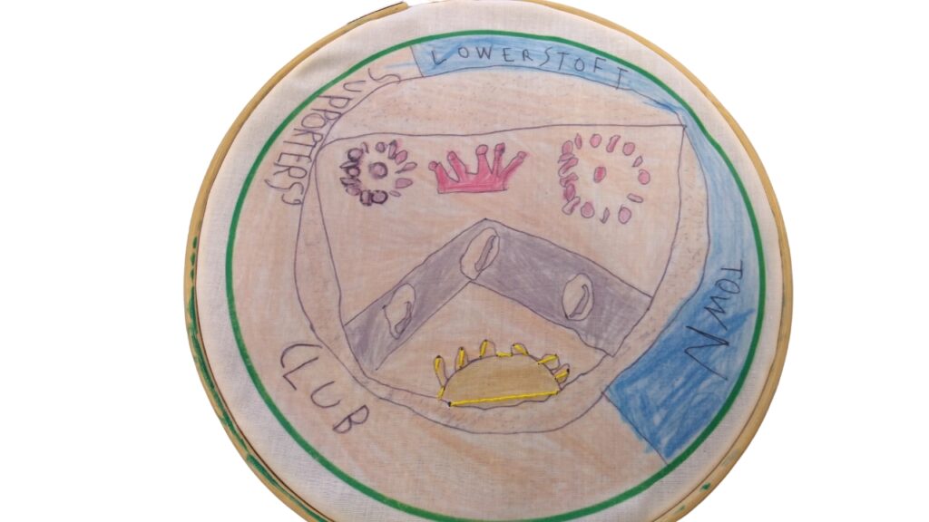 An embroidered picture of the Lowestoft Town Supporters Club crest