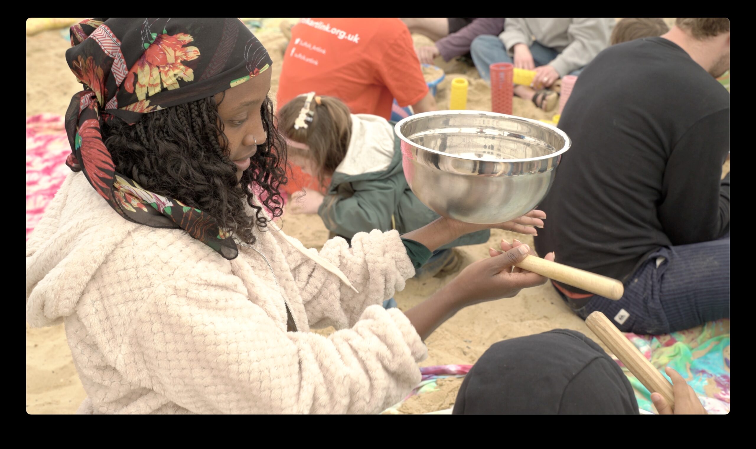 Child about to make a silver bowl start ringing