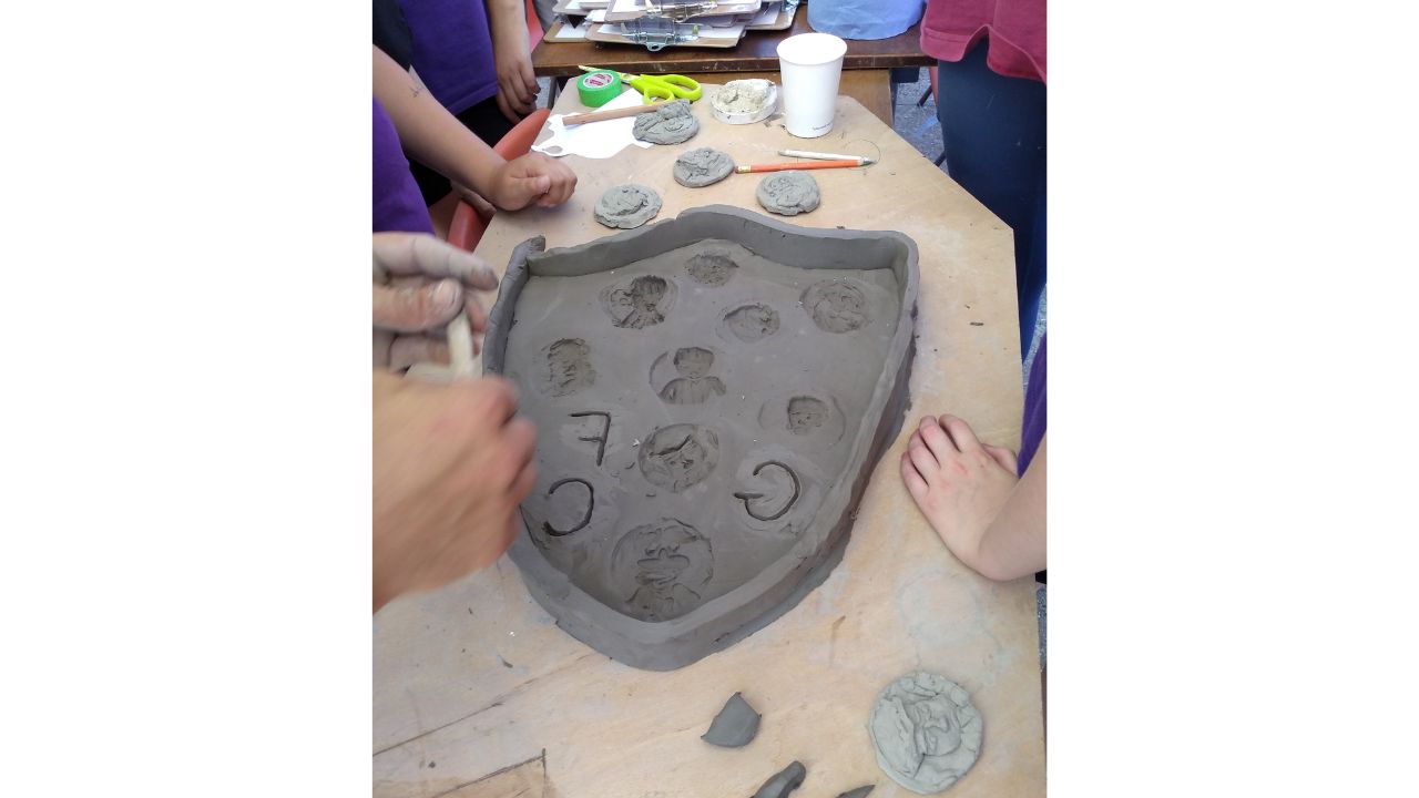 The clay shield mould now has lots of discs cast into it as well as the letters GFC for Garretts Football Club. There is now a clay rim around the edge
