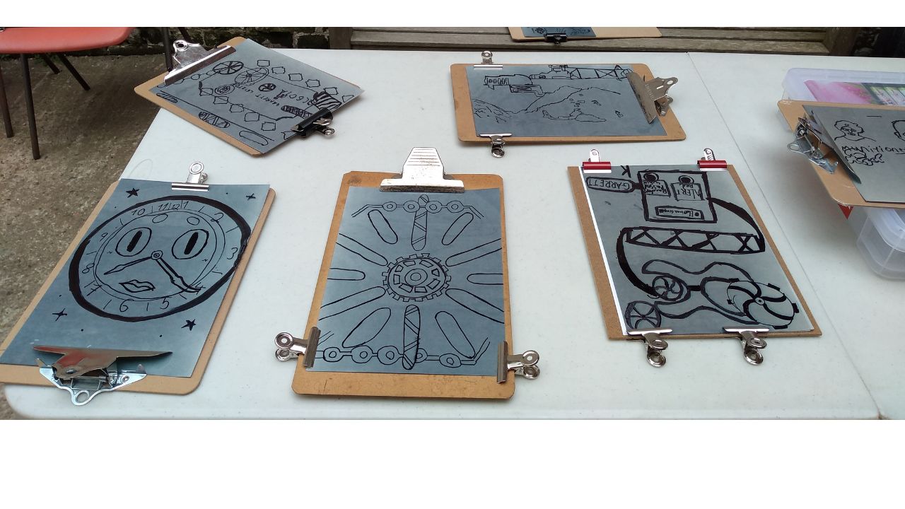 Tracings and drawings on acetate over light sensitive paper, during the exposure period