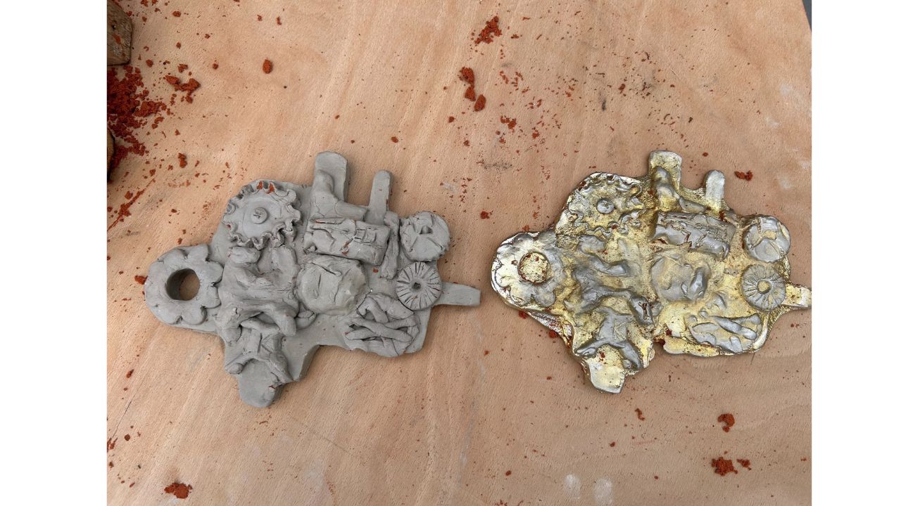 Clay model left with resulting pewter cast on right