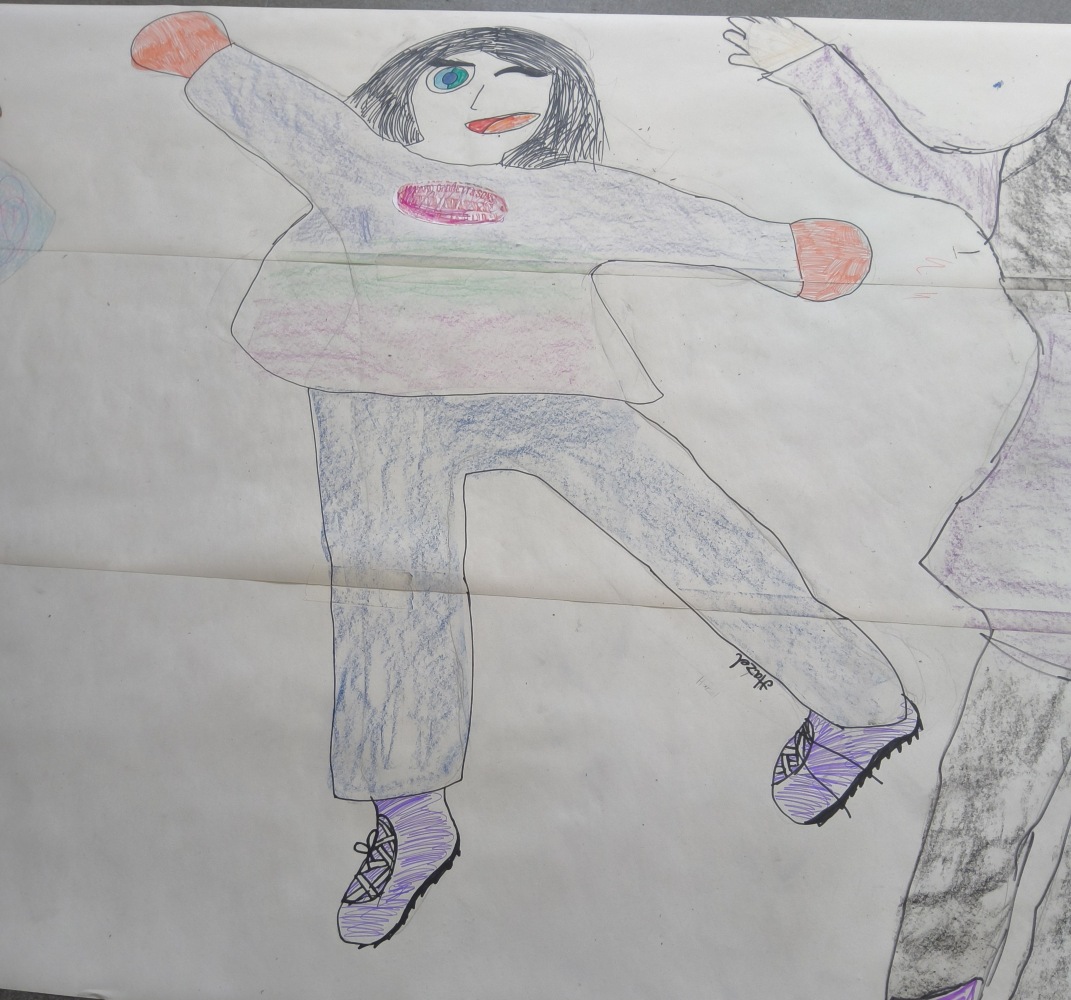 A large drawing of a football player with one eye closed and fancy laced boots