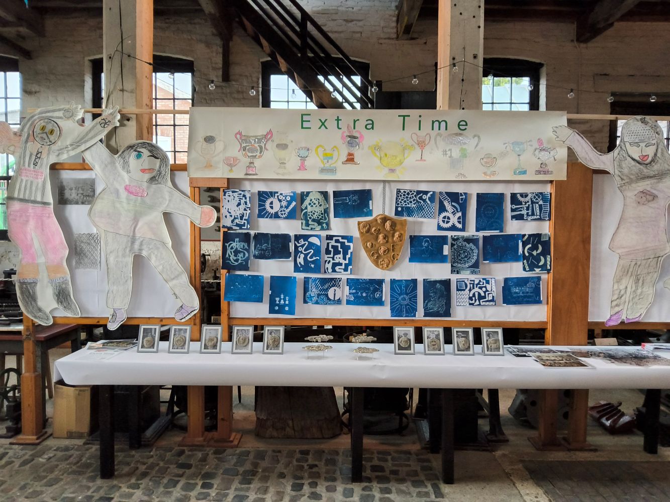 The Extra Time display at the Long Shop Museum, featuring life sized football figures, photographs, shields and cyanotype prints