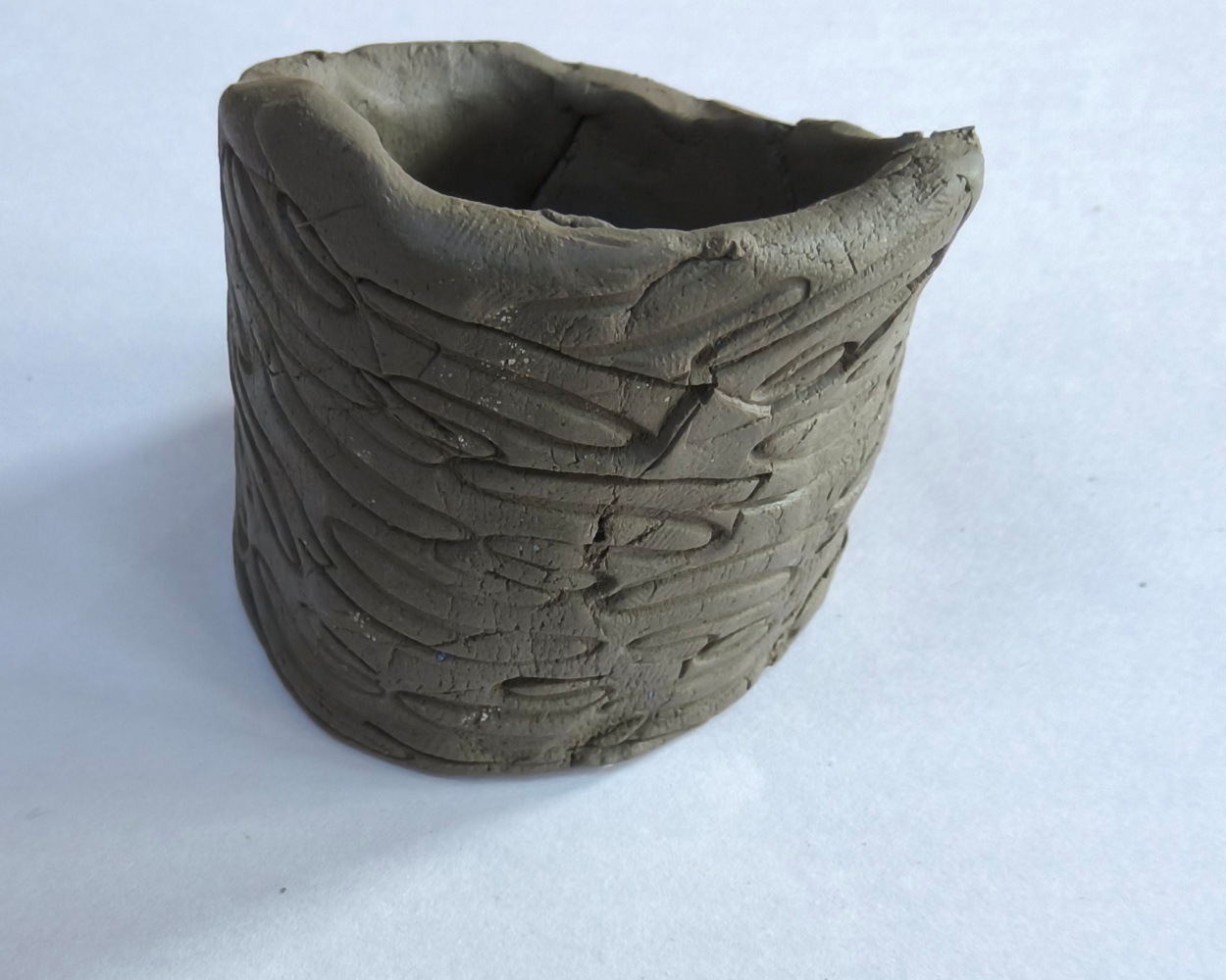 A decorated clay amulet